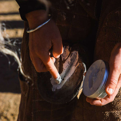 EquiMud hoof clay being applied to hoof